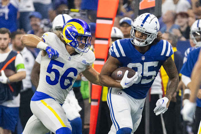 Oct 1, 2023; Indianapolis, Indiana, USA; Indianapolis Colts tight end Drew Ogletree (85) runs with the ball while Los Angeles Rams linebacker Christian Rozeboom (56) defends in the second half at Lucas Oil Stadium. Mandatory Credit: Trevor Ruszkowski-USA TODAY Sports